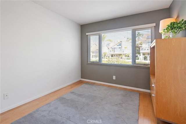 unfurnished room featuring light wood-type flooring