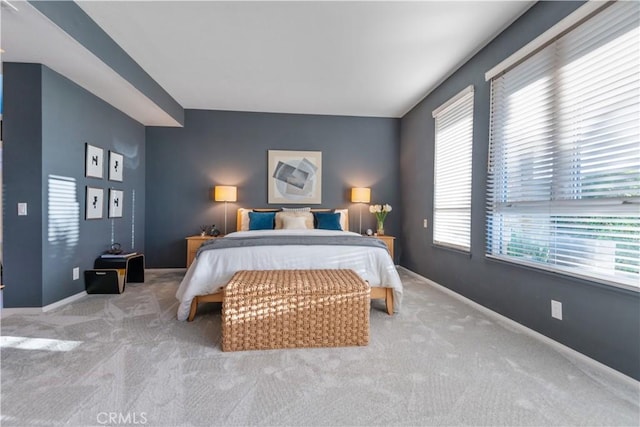 bedroom featuring light colored carpet