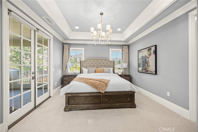 bedroom with access to exterior, an inviting chandelier, a tray ceiling, ornamental molding, and light carpet