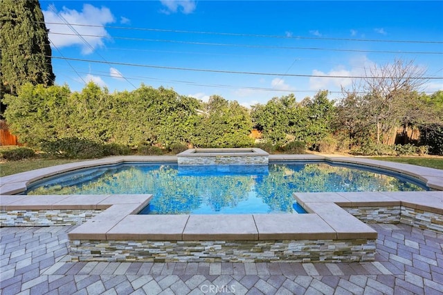 view of pool featuring an in ground hot tub