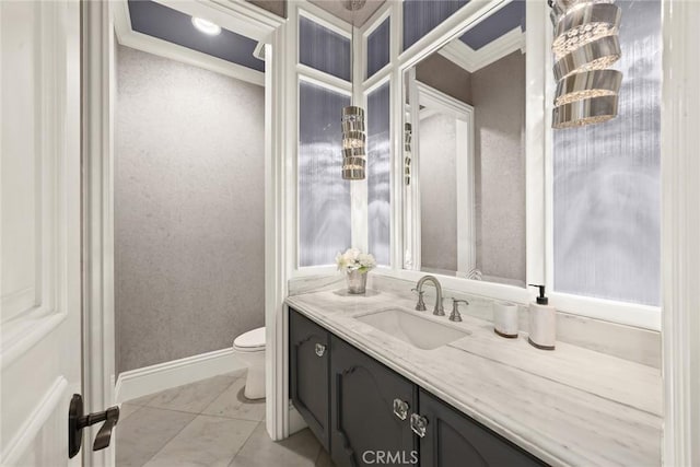 bathroom featuring tile patterned floors, toilet, vanity, and ornamental molding