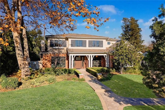 view of front of property featuring a front lawn