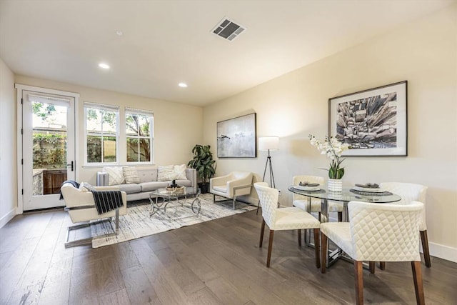 dining area with dark wood-type flooring