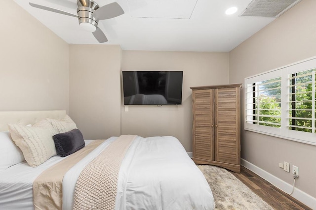 bedroom featuring dark wood-type flooring and ceiling fan