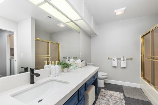 full bathroom featuring vanity, combined bath / shower with glass door, and toilet