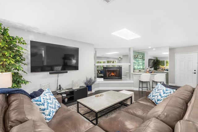 living room featuring hardwood / wood-style floors and a wealth of natural light