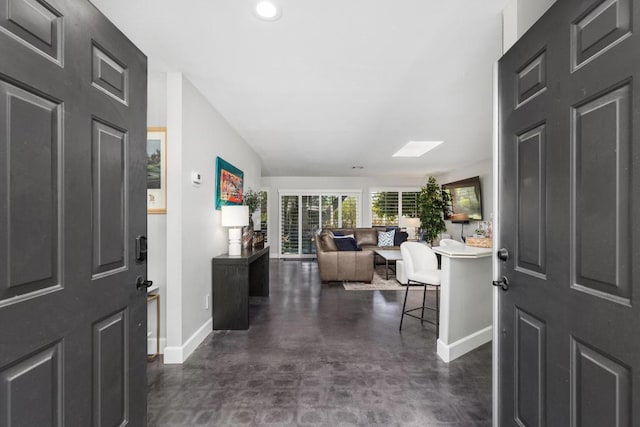 foyer featuring a skylight