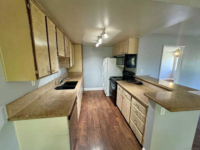 kitchen with electric range, rail lighting, kitchen peninsula, dark hardwood / wood-style flooring, and sink