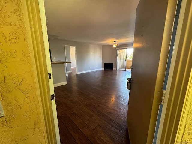 unfurnished room featuring dark wood-type flooring