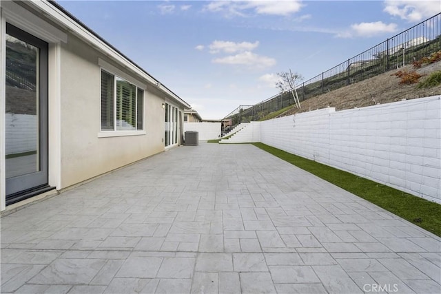 view of patio with central AC unit