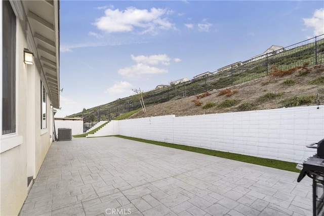 view of patio featuring grilling area and central air condition unit