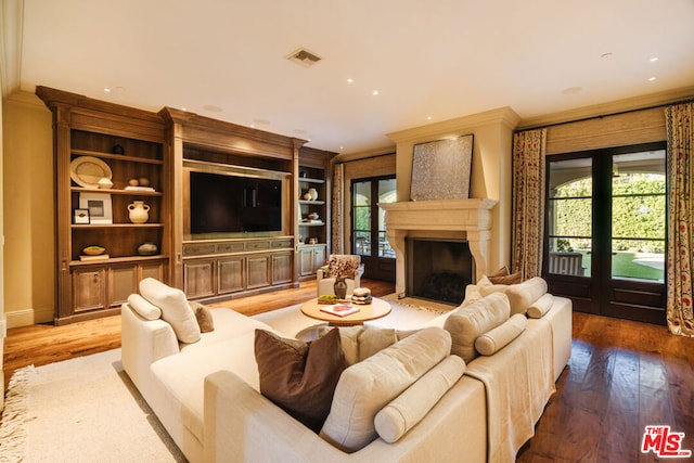 living room with plenty of natural light and hardwood / wood-style floors