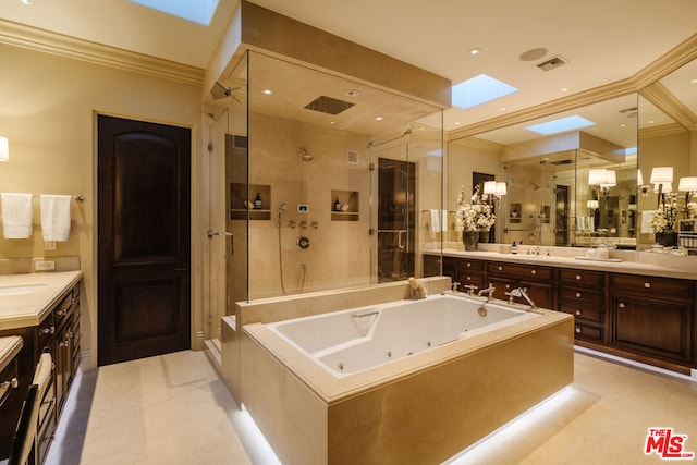 bathroom with vanity, a skylight, tile patterned floors, and shower with separate bathtub