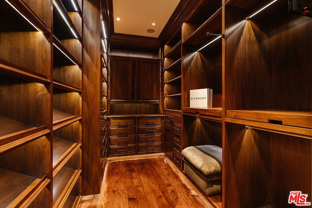 wine room with hardwood / wood-style floors