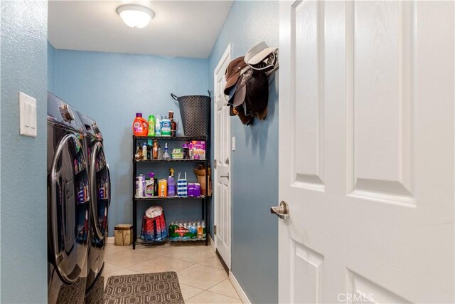 laundry area featuring light tile patterned floors and independent washer and dryer