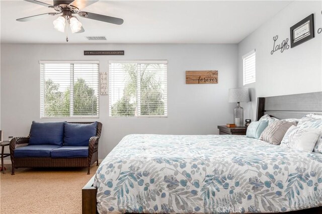 bedroom with ceiling fan and carpet