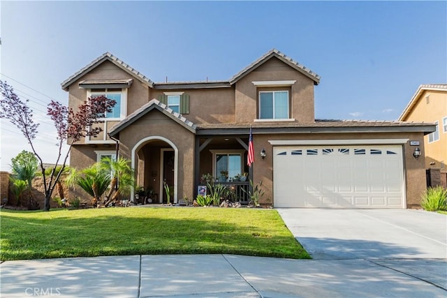 front facade featuring a front lawn and a garage