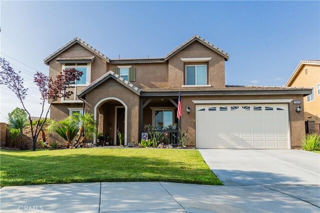 front facade with a front yard and a garage