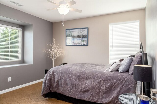 carpeted bedroom with ceiling fan