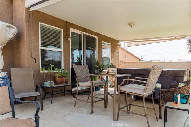 view of patio / terrace featuring a hot tub