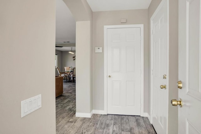 corridor with light wood-type flooring