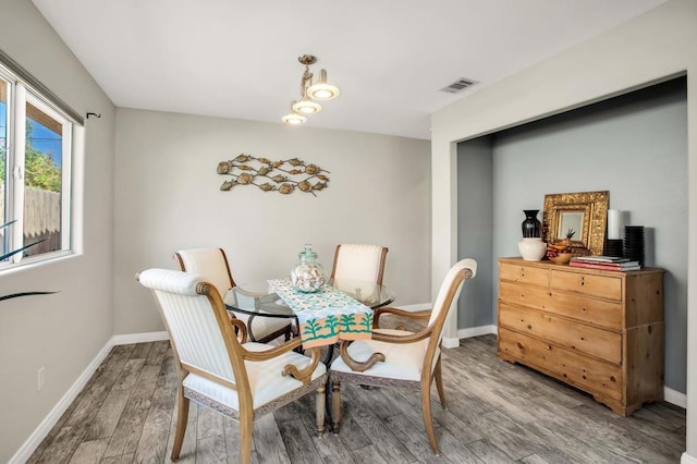 dining room with wood-type flooring