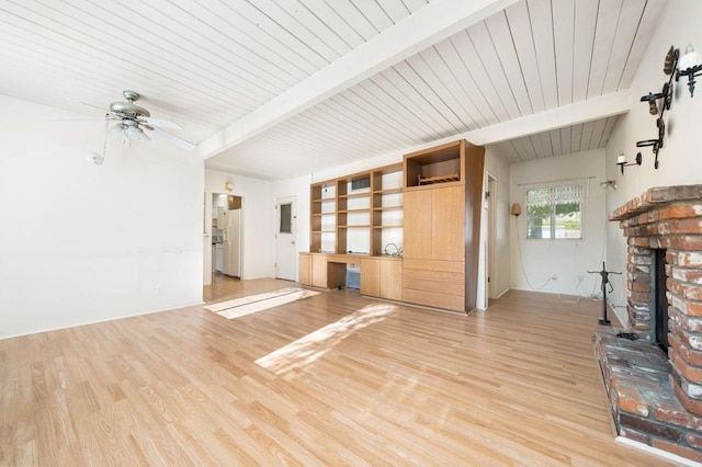 unfurnished living room featuring ceiling fan, light hardwood / wood-style floors, and beamed ceiling