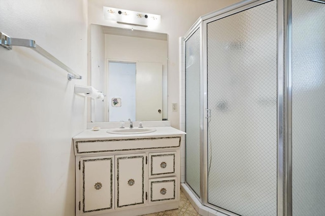 bathroom featuring an enclosed shower and vanity