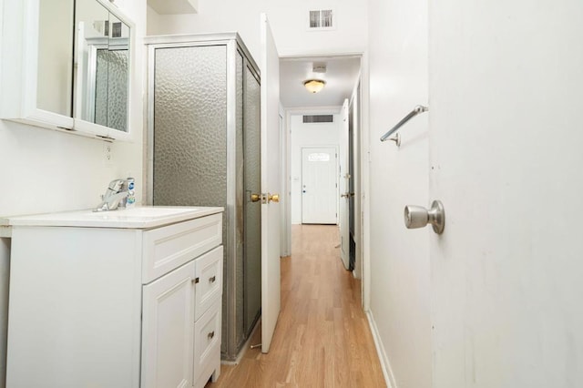 interior space with sink and light wood-type flooring