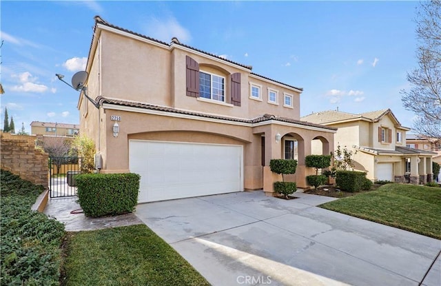 mediterranean / spanish-style house featuring a front lawn and a garage