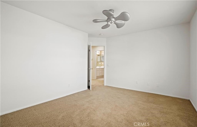 carpeted empty room with ceiling fan