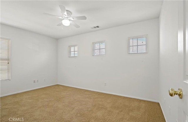 unfurnished room with light carpet and ceiling fan