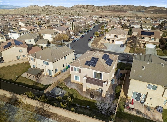 birds eye view of property featuring a mountain view