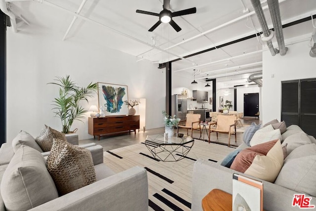 living room featuring ceiling fan