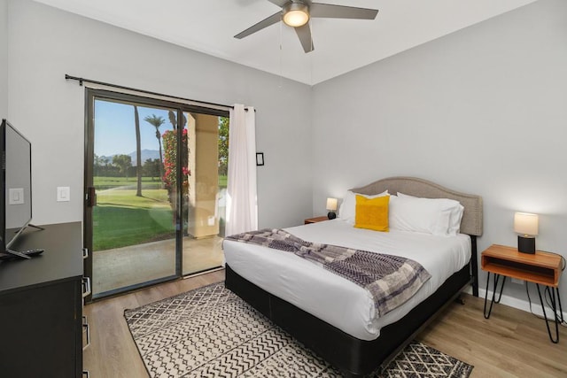 bedroom with ceiling fan, access to exterior, and light hardwood / wood-style flooring