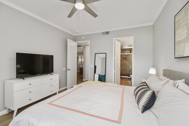 bedroom featuring ceiling fan, hardwood / wood-style flooring, and ensuite bathroom