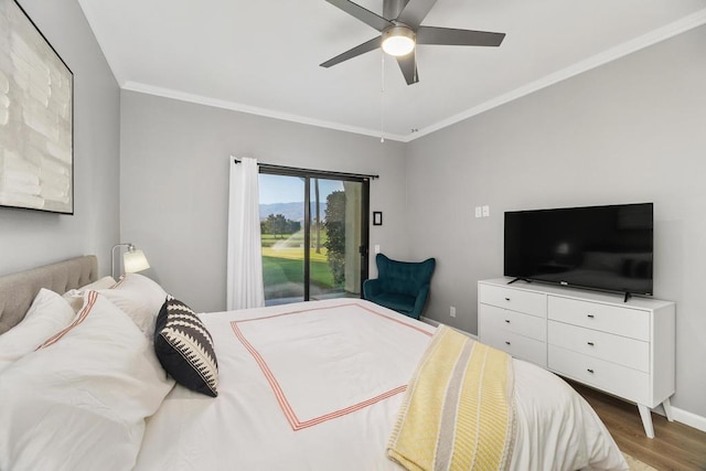 bedroom featuring dark wood-type flooring, ceiling fan, and crown molding