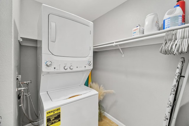 laundry room with stacked washer and dryer