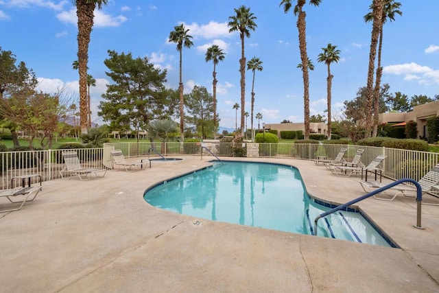 view of swimming pool with a patio