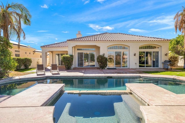 rear view of house featuring a patio area