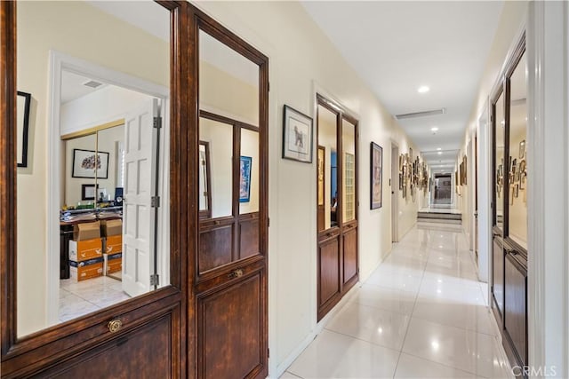 corridor with light tile patterned floors