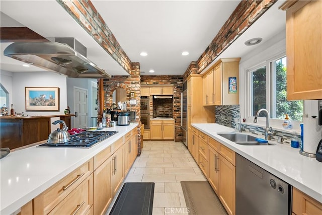 kitchen featuring appliances with stainless steel finishes, extractor fan, light brown cabinets, tasteful backsplash, and sink