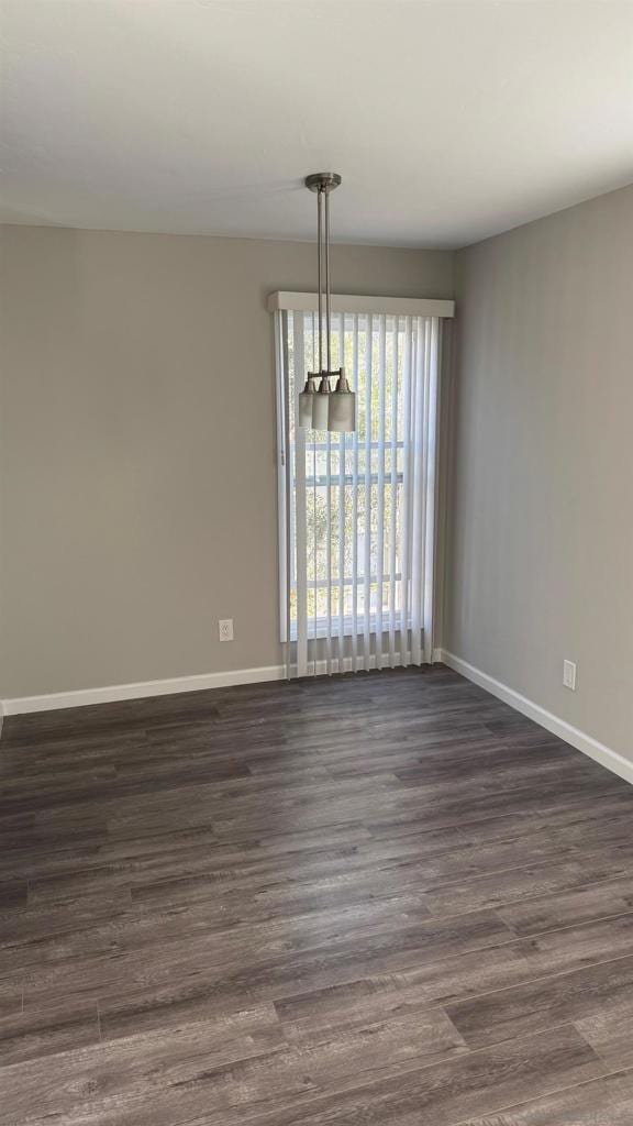 unfurnished dining area with dark hardwood / wood-style floors