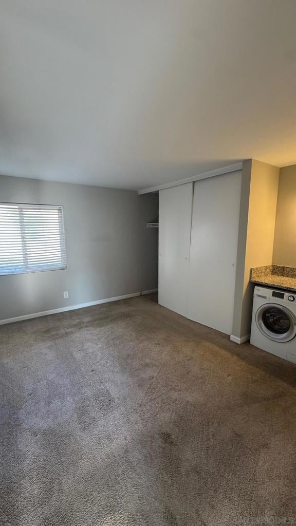 interior space with washer / dryer and carpet