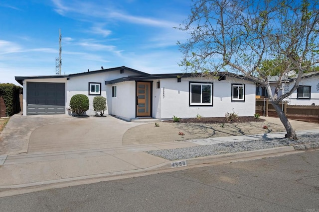 ranch-style home featuring a garage