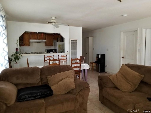 living room with ceiling fan and light tile patterned floors