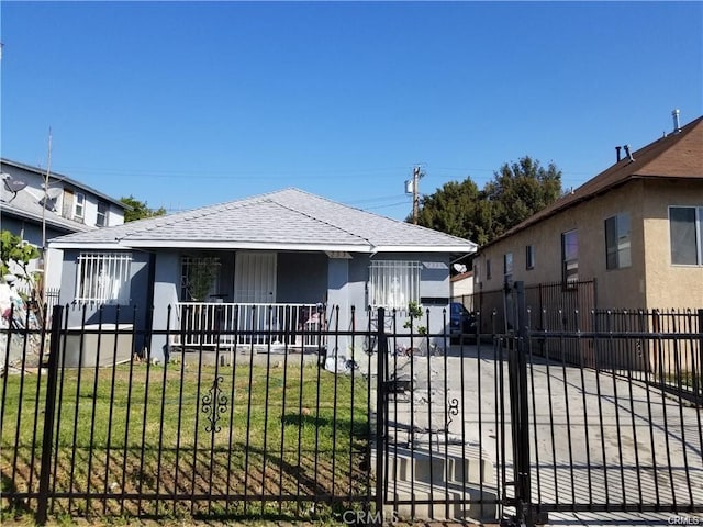 view of front of property with covered porch and a front yard