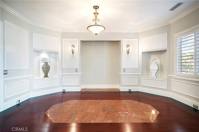 dining room featuring dark wood-type flooring and ornamental molding