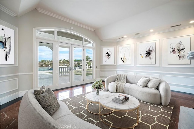 living room with ornamental molding, lofted ceiling, and french doors