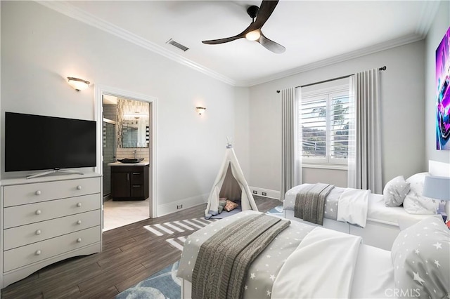 bedroom with ceiling fan, ensuite bath, dark hardwood / wood-style floors, and ornamental molding